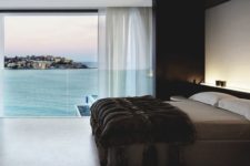 03 a spacious masculine bedroom with a gorgeous sea view