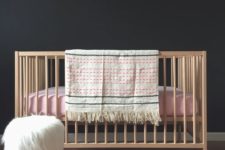 04 IKEA Sniglar crib in a black nursery with blush and pink accent – ideal for a girl’s space