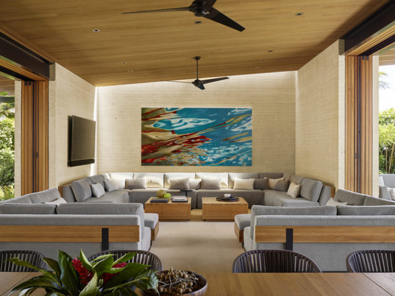 The living room features a large corner sofa and two smaller corner ones for creating a large conversation pit