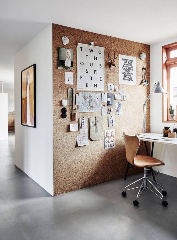 a cork wall is a great and creative idea for any workspace, and its softness adds warmth to the space