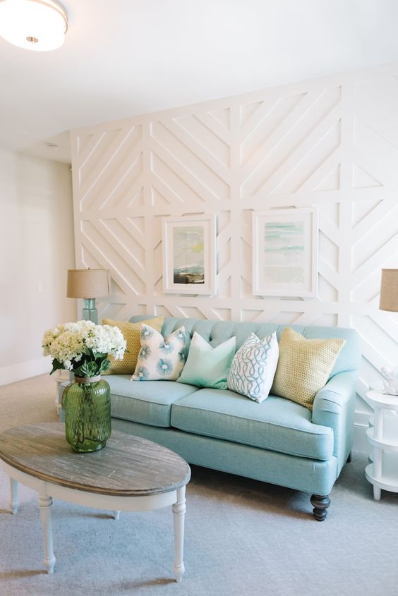 A cottage style space with a wwhite paneled wall that catches an eye