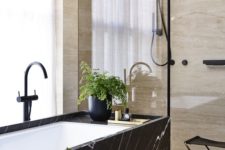 04 a spa feel can be added with materials used, for example, a bathtub clad with black marble