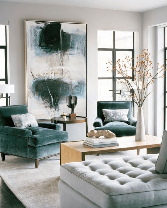 the oversized artwork matches the grey green chair upholstery