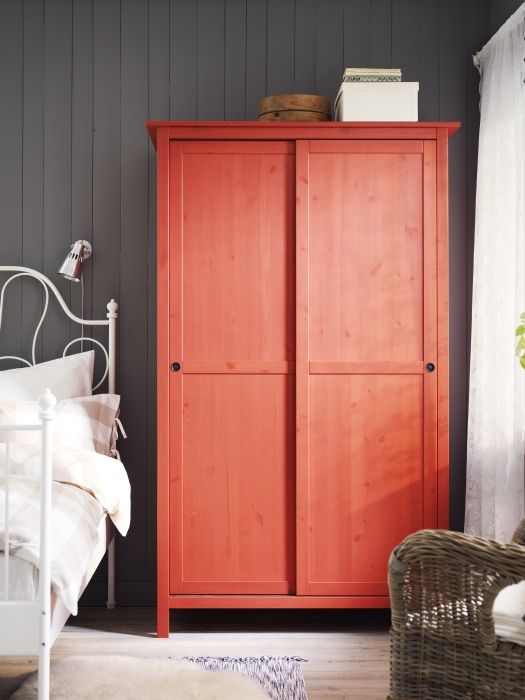 Hemnes with sliding doors painted red looks rustic yet colorful and makes a statement