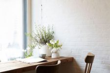 05 a wooden windowsill and chairs make an industrial space cozier