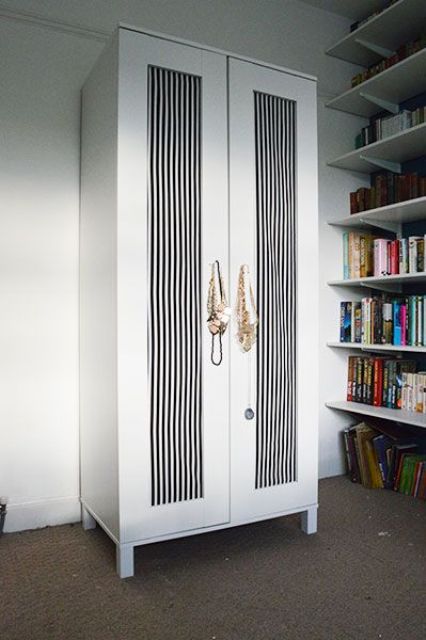 Aneboda wardrobe with black and white striped doors for an elegant feel