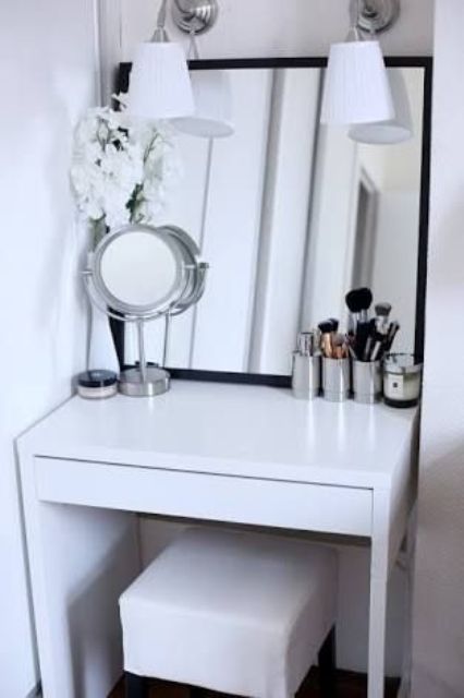 a small and stylish makeup nook done with a Micke desk, a comfy stool and some mirrors
