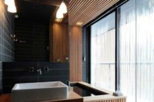 07 a contemporary bathroom with a spa feel, which is achieved with wood and a wood clad bathtub
