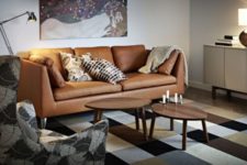 07 a cozy living room with a tan leather Stockholm sofa and a printed rug