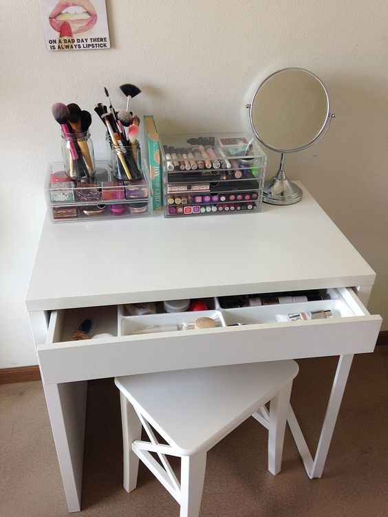 a simple makeup zone with a Micke desk and a stool, all the makeup in an acrylic unit