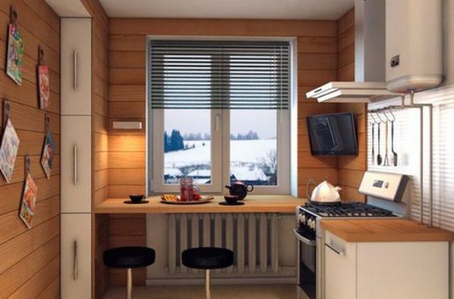 a small kitchen clad with wood and a windowsill bar with modern stools and a view