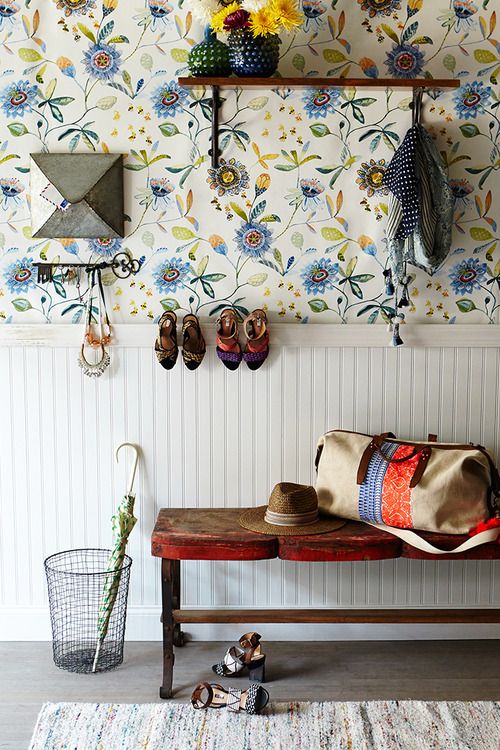 blue floral print wallpaper and wainscoting gives the entryway a cozy farmhouse feel