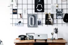 09 a black grid hung over the desk is a great piece to use as a pinboard