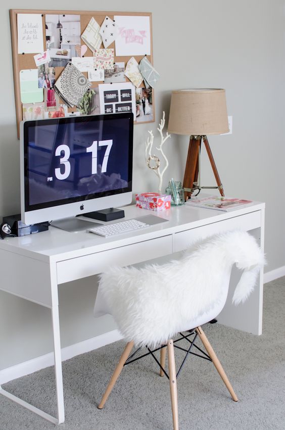 a comfy workspace with a Micke desk, a table lamp and a pinboard, a comfy chair is a perfect fit