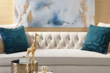 09 an abstract artwork with gold leaf is a great addition for a glam interior