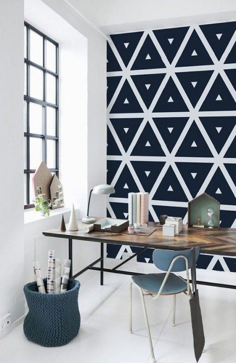 a geometric black and white wallpaper wall is a chic idea for a Scandinavian space