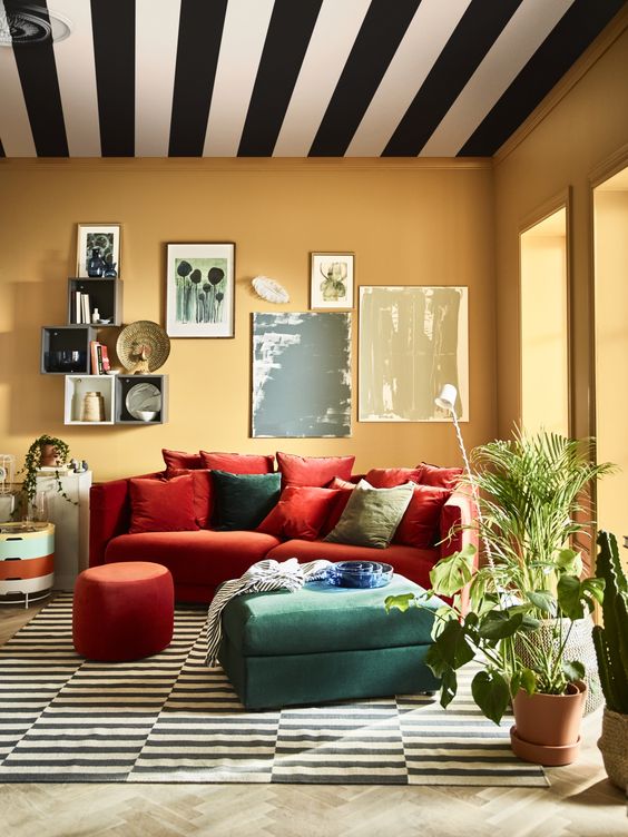 a colorful space with an orange Stockholm sofa and a green ottoman for a colorful touch