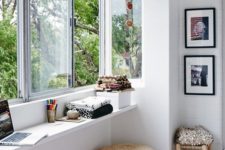 11 a window with a narrow windowsill used as a desk and for storage