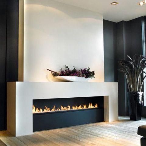 an ultra-modern ethanol fireplace in black and white will be a refined feature