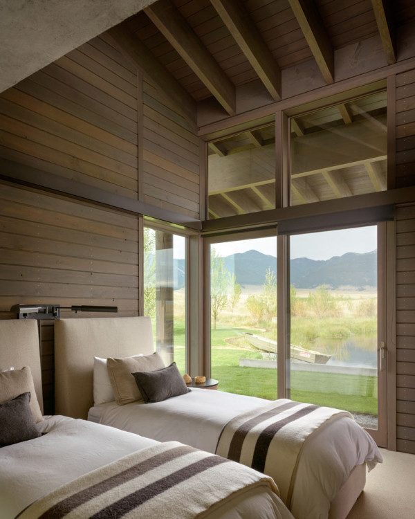 Every space including guest bedrooms features cool views of the ponds and nature