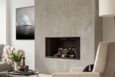 12 a concrete wall with a built-in fireplace for a modern feel