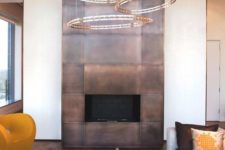 12 a fireplace highlighted with copper panels for safety and a bold modern look