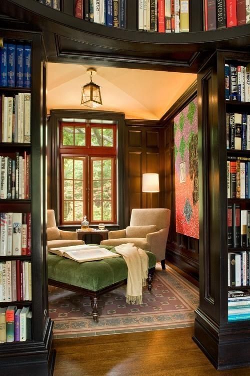 an oversized green upholstery ottoman with a refined design adds to the study style