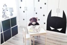 13 a Dombas wardrobe stenciled with black crosses to fit a Scandinavian kid’s room