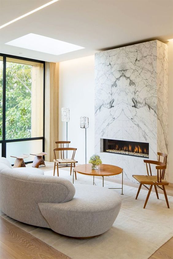 a marble clad wall unit with an ethanol fireplace for a refined look