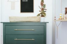 14 IKEA Rast hack in emerald as a small and comfy changing table
