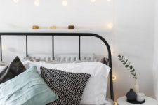 14 a ledge with cute printables in frames and string lights create a welcoming and cozy ambience