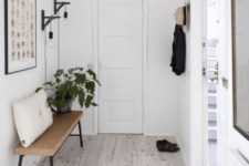 14 a minimal entryway with a metal and cork bench that is perfectly cozy and comfy