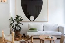 14 an abstract statement artwork is the focal point in this neutral space