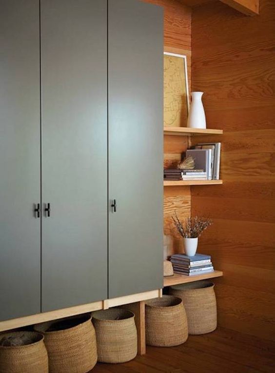 IKEA Dombas wardrobe put on tall legs for additional storage space, re painted in grey and with stylish knobs