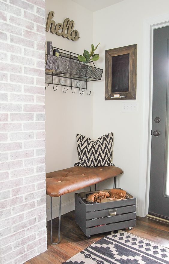 brign an industrial feel to your space with a hairpin leg and leather bench in the corner