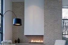 16 a creamy brick wall and a built-in fireplace with a hood for a cool look