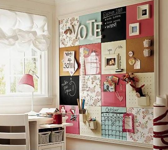 a large pinboard covered with various types of fabric to create a bold and eclectic look