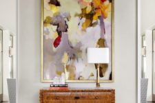 17 a bold colorful artwork makes a statement in this entryway