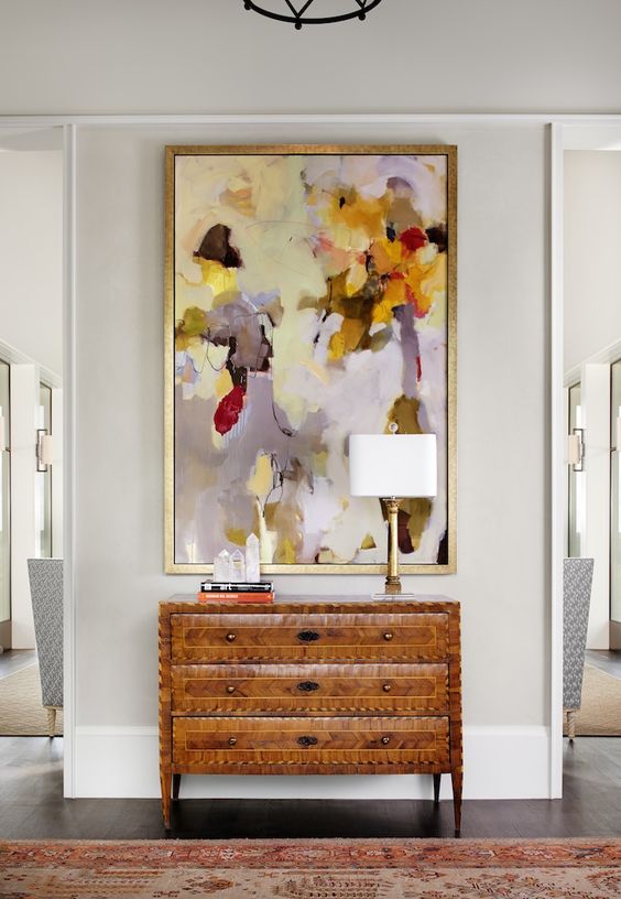 a bold colorful artwork makes a statement in this entryway