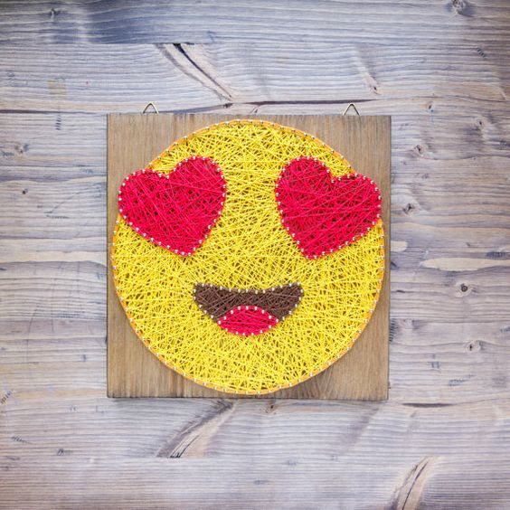 a bold string art with in love emoji is a chic modern piece for decor