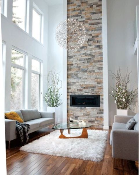 a built-in fireplace highlighted with a vertical brick stripe coming up to the ceiling