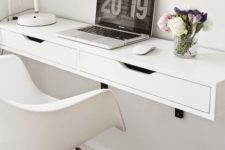 17 a comfy white floating desk with a couple of drawers for hiding some stuff