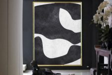 17 an oversized abstract wall art will make your entryway super chic and refined