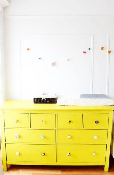 IKEA Hemnes hack in bold yellow with different knobs for a bold nursery