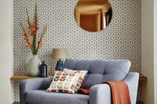 18 the mid-century modern style of the room is highlighted with this eye-catchy wallpaper wall