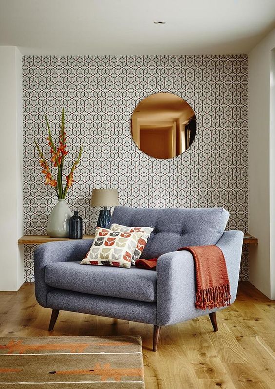 The mid century modern style of the room is highlighted with this eye catchy wallpaper wall