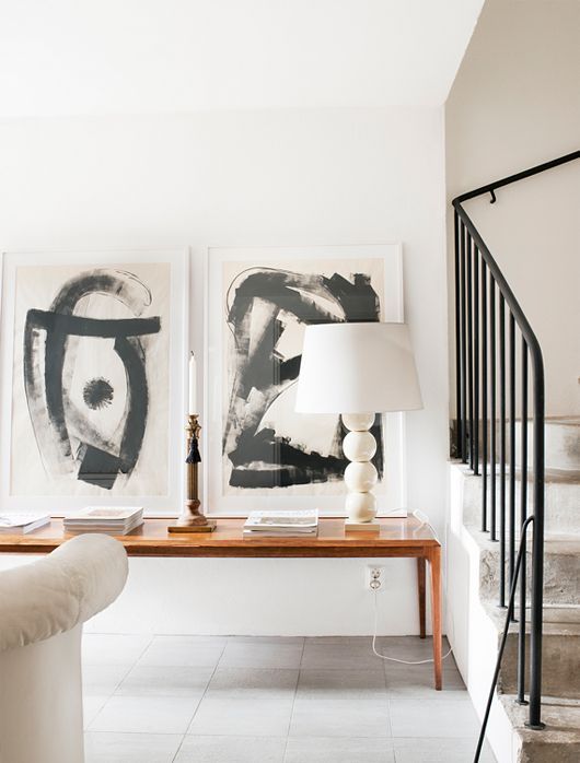 an abstract black and white artwork duo is a chic idea for a modern interior