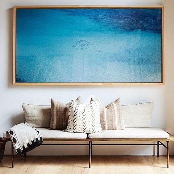 A sea artwork is always a win win idea and will add a relaxing touch to the space