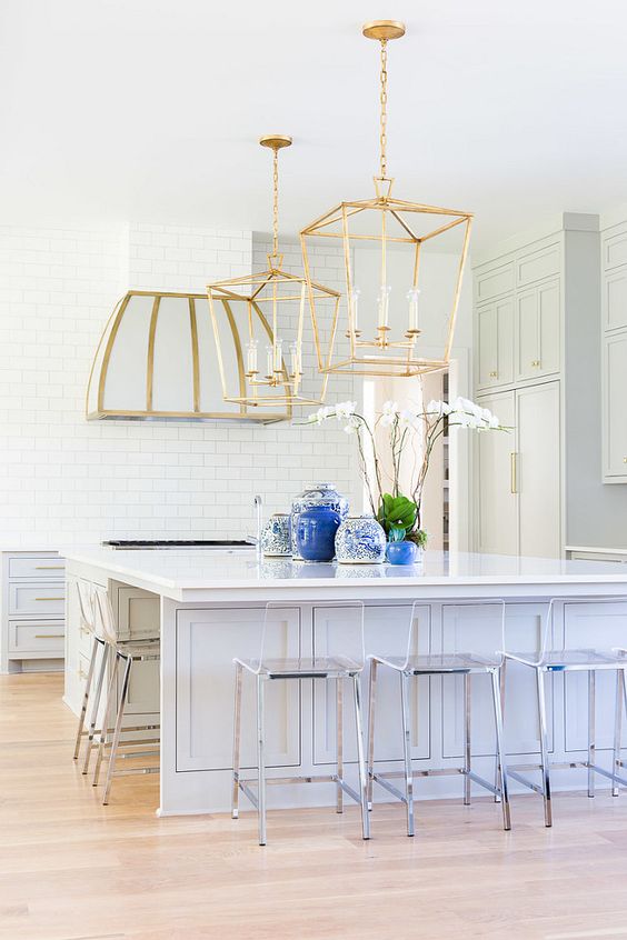 large brass pendant lamps and hood and stainless steel chairs