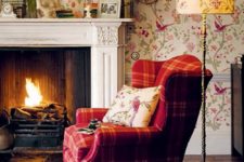 22 an English country living room with colorful flora and fauna print wallpaper to add to the style